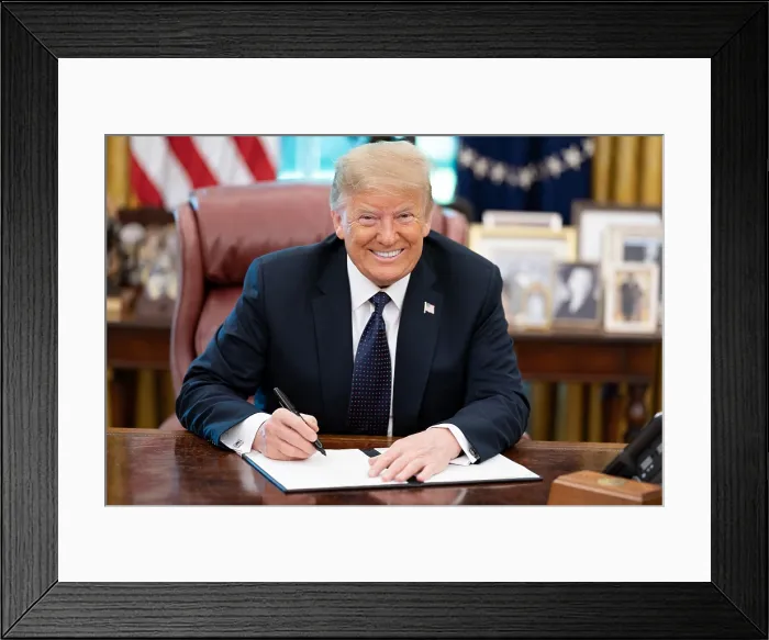 Framed Print : President Donald Trump smiles into the camera as he signs a memorandum supporting the US Lobster Industry, June 24, 2020