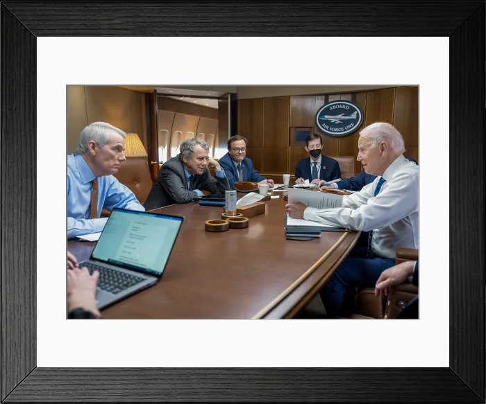 Framed Print : President Joe Biden meets with his traveling guests Ohio Senators, Republican Rob Portman (left), and Democrat Sherrod Brown (center) aboard Air Force One, Jan. 4, 2023