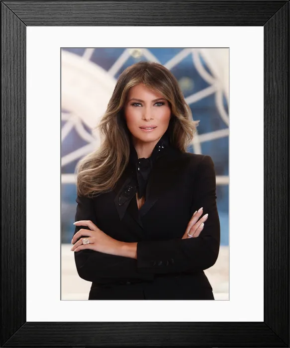 Framed Print : Official photo of First Lady Melania Trump, in the White House residence. She stands with her arms crossed, smiling, and looking into the camera, with slight smile on her face Framed Print : Official photo of First Lady Melania Trump, in the White House residence. She stands with her arms crossed, smiling, and looking into the camera, with slight smile on her face