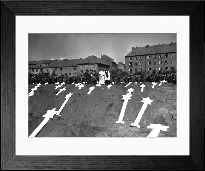 Framed Print : Markers are for the graves of 80 victims of the Nazis found in Ludwigslust, Germany