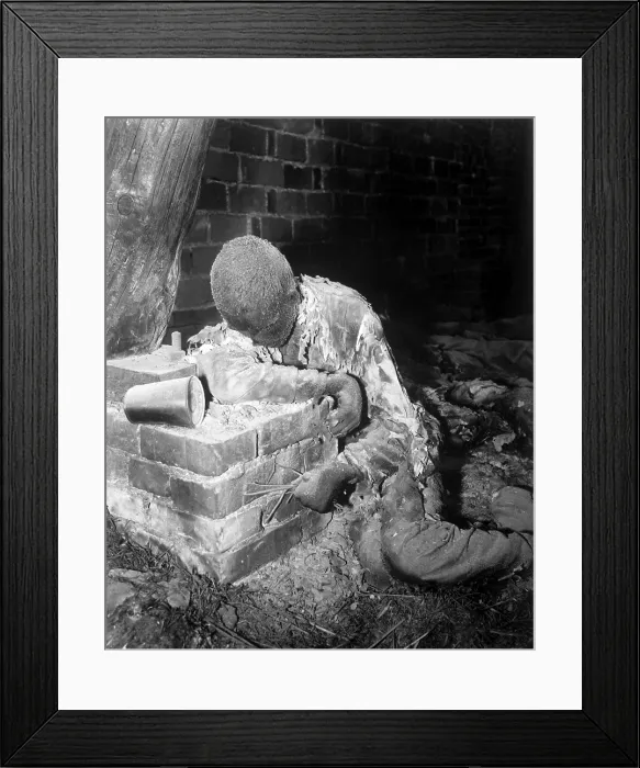 Framed Print : A victim of the Gardelegen massacre of April 13, 1945. German SS and Luftwaffe troops forced 1, 016 weakened slave laborers into a large barn that they then set on fire