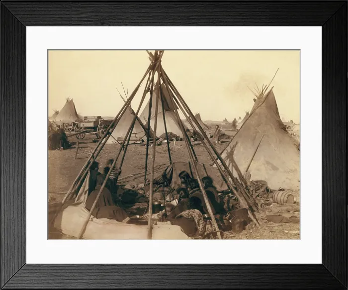 Framed Print : Oglala Sioux women and children inside an uncovered tipi frame near Pine Ridge Agency, Jan. 1891