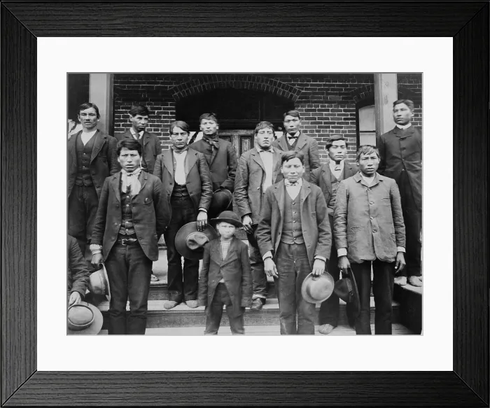 Framed Print : Native American young men and a boy posed on the steps of Carlisle Indian School, c. 1890