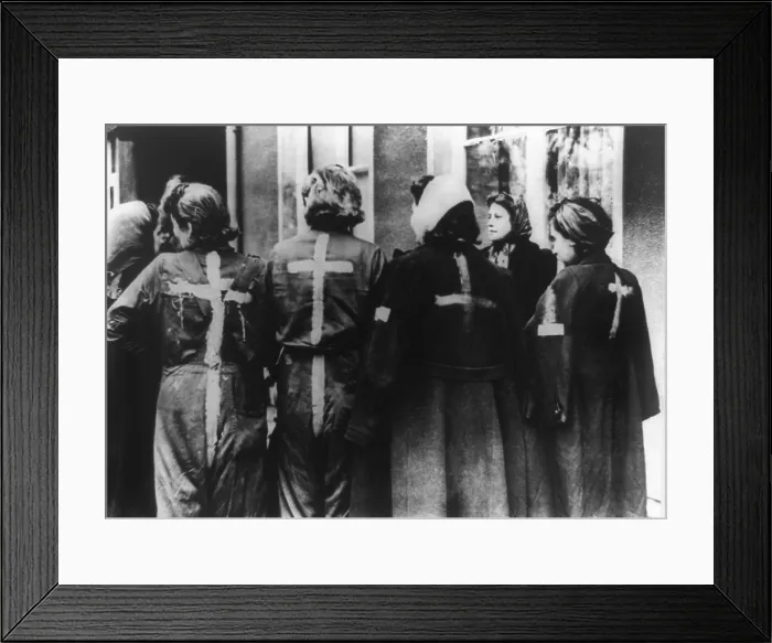 Framed Print : Four Jewish girls, with yellow crosses painted on backs of their clothing by Nazis. The young women were liberated by U.S. 9th Army from an ammunition factory in Kaunitz, Germany Framed Print : Four Jewish girls, with yellow crosses painted on backs of their clothing by Nazis. The young women were liberated by U.S. 9th Army from an ammunition factory in Kaunitz, Germany