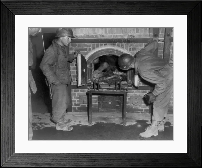 Framed Print : Three U.S. Army soldiers looking at bodies in oven of an unidentified German concentration camp. April 8-24, 1945. (BSLOC_2014_4_49)