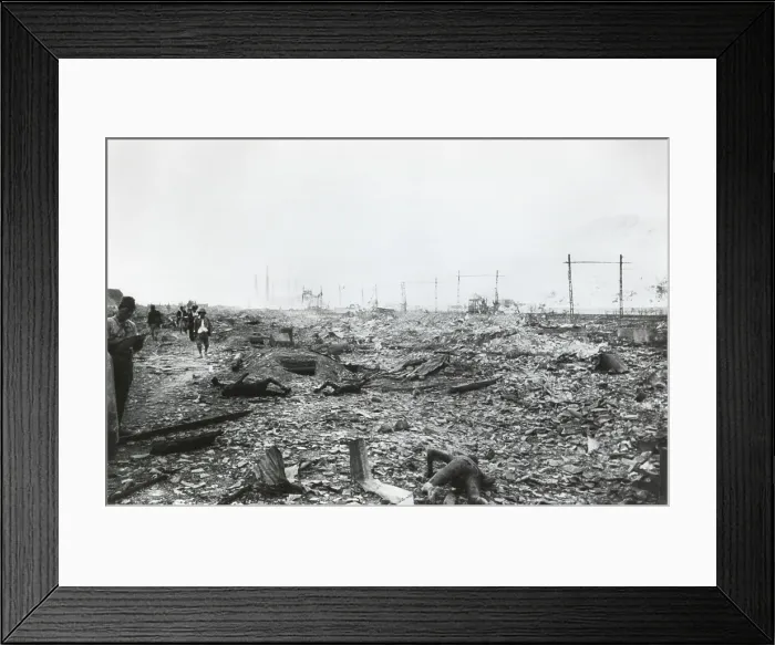 Framed Print : Ruins of Nagasaki, Japan, after atomic bombing of August 9, 1945. Government officials walk amid radioactive debris and burnt corpses on August 10, 1945. Photo by Yosuke Yamahata