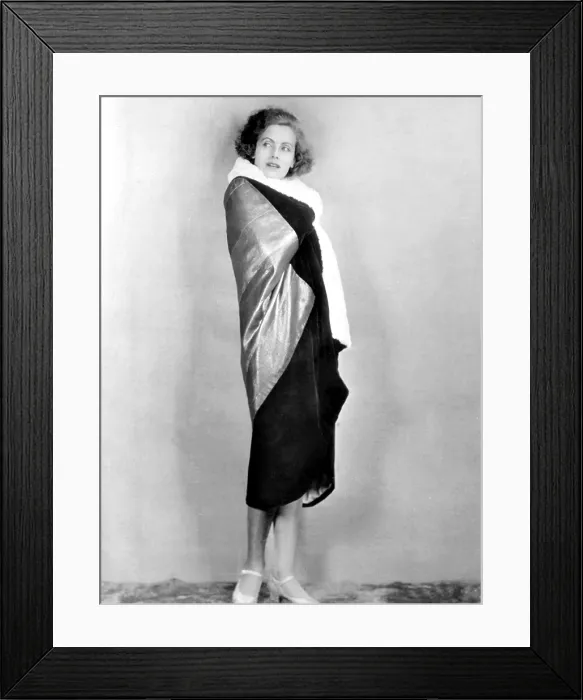 Framed Print : TORRENT, Greta Garbo, modeling an evening wrap gold metal cloth and black velvet, 1926