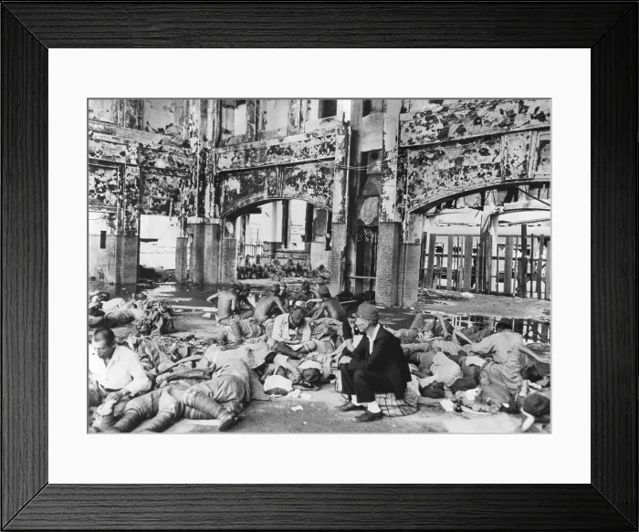 Framed Print : Japanese troops resting in railway station after Hiroshima explosion