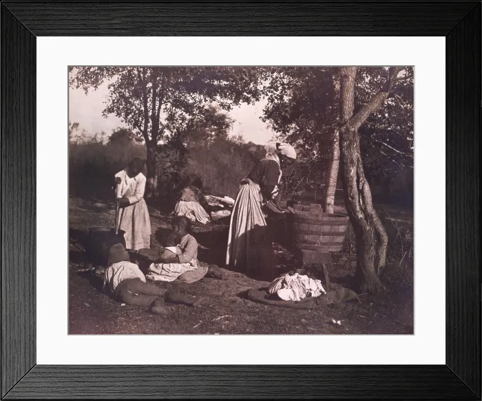Framed Print : WASH DAY ON THE PLANTATION by Rudolf Eickemeyer, 1887. African Americans doing laundry outdoors in a wash tub, as water is warmed in a cauldron over a fire