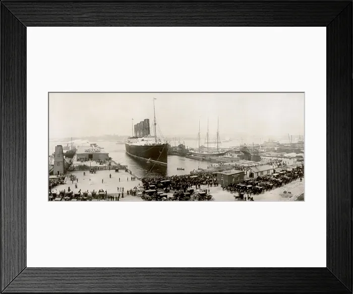 Framed Print : RMS Lusitania in New York harbor at end of a 1907 voyage. As the luxury liner docks, a crowd and taxis wait for passengers. (BSLOC_2012_4_107)