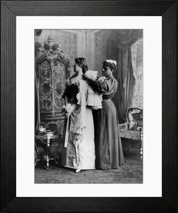 Framed Print : African American ladys maid helps a wealthy woman get dressed in luxurious evening gown, 1897. (BSLOC_2017_20_111)