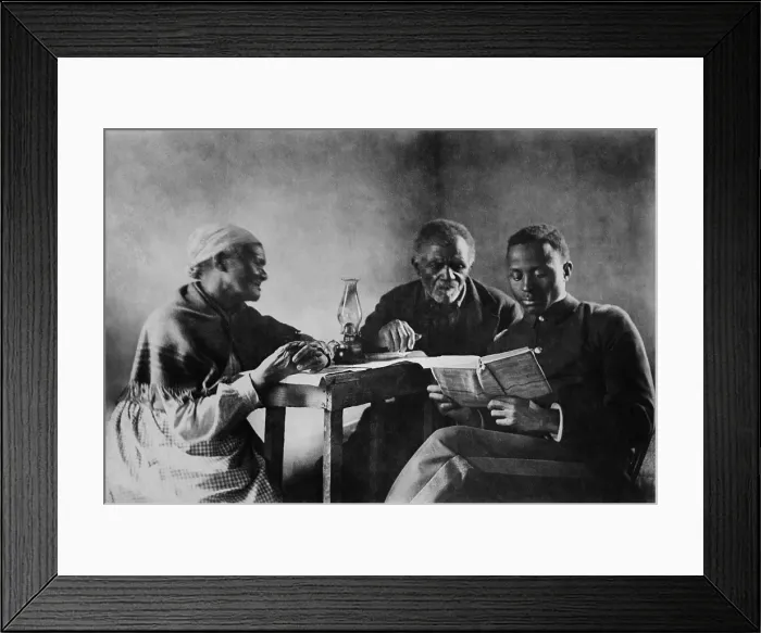 Framed Print : African American son reading the Bible to his parents, c. 1890-1920. This generational family portrait evokes the hope of progress after slavery Framed Print : African American son reading the Bible to his parents, c. 1890-1920. This generational family portrait evokes the hope of progress after slavery