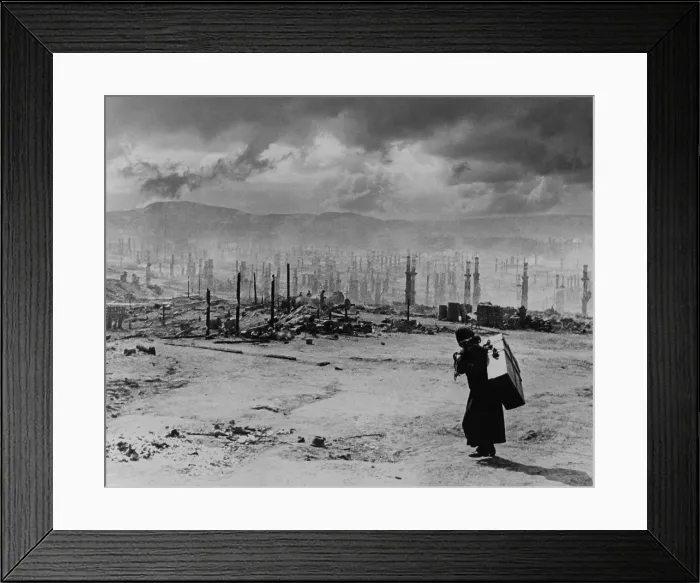 Framed Print : World War 2, Ruins of Murmansk in 1942. Soviet woman carrying large suitcase on her back, walks past the charred remains of Murmansk. 1942 photo by Yevgeny Khaldei