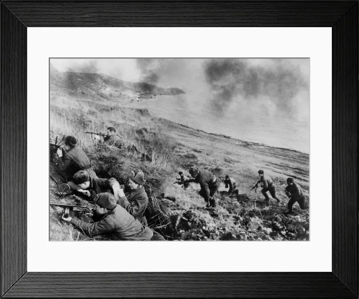 Framed Print : World War 2, Soviet female medic in battle. Soviet soldiers fighting up a hill from a beach; in foreground a woman medic bandages the arm of an injured soldier Framed Print : World War 2, Soviet female medic in battle. Soviet soldiers fighting up a hill from a beach; in foreground a woman medic bandages the arm of an injured soldier
