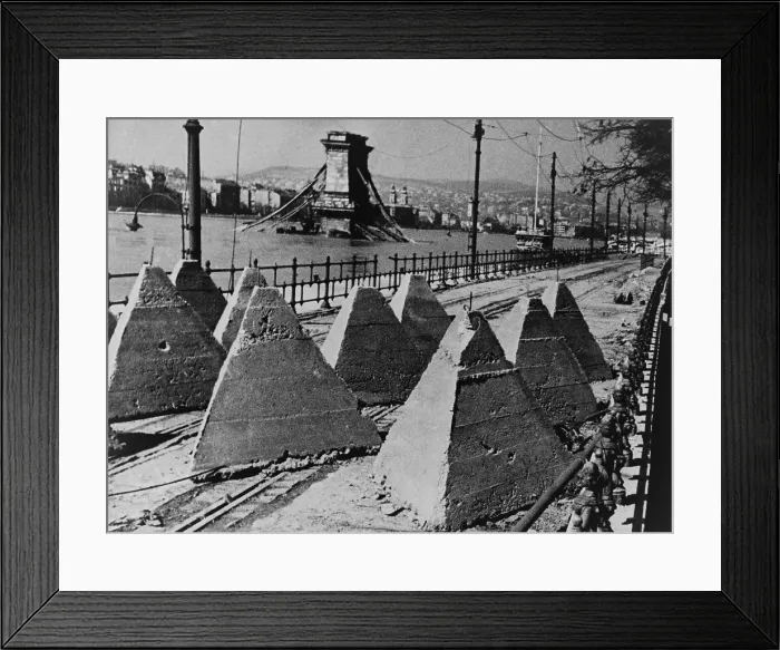 Framed Print : World War 2 anti-tank barriers along the river in Budapest. Retreating Germans and Hungarian forces destroyed the Chain Bridge as Soviet forces took the city. Feb