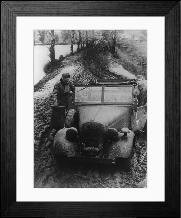Framed Print : German soldier and officer pushing their car through Russian mud. In fall 1941, the semiannual Russian mid season slowed the German invasion into the Soviet Union. Nov. 11, 1941