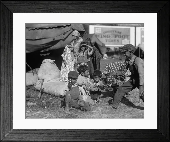 Framed Print : Gypsies children at play in an encampment, possibly a circus, in the Washington, D.C. Vicinity, 1923. Nearby a woman holds a garment among several stuffed bags in a tent Framed Print : Gypsies children at play in an encampment, possibly a circus, in the Washington, D.C. Vicinity, 1923. Nearby a woman holds a garment among several stuffed bags in a tent