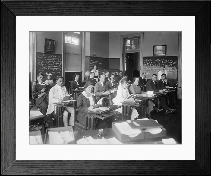 Framed Print : Men and Women in an Americanization class in the Washington, D.C. area, c. 1920. Composed mostly of Europeans with one East Asian man, the class met in a school room