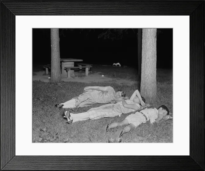 Framed Print : Escaping stuffy apartments during nighttime summer heat in Rock Creek Park, 1926. Two women and a boy rest on the grass in Washington, D.C. after dark Framed Print : Escaping stuffy apartments during nighttime summer heat in Rock Creek Park, 1926. Two women and a boy rest on the grass in Washington, D.C. after dark