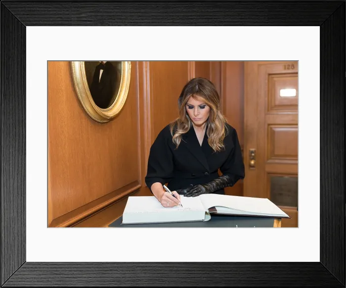 Framed Print : First Lady Melania Trump signing the guest book at the investiture of Brett Kavanaugh, as an Associate Justice of the Supreme Court, Nov. 8, 2018 (BSLOC_2018_9_196)