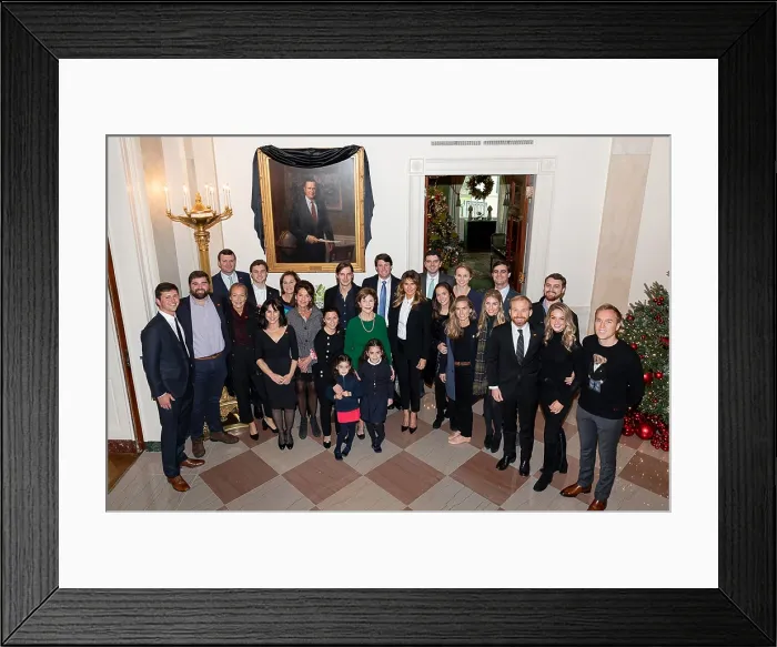 Framed Print : First Lady Melania Trump with former First Lady Laura Bush and extended Bush family members in front of the draped portrait of the late President, George H.W. Bush, Tuesday, Dec