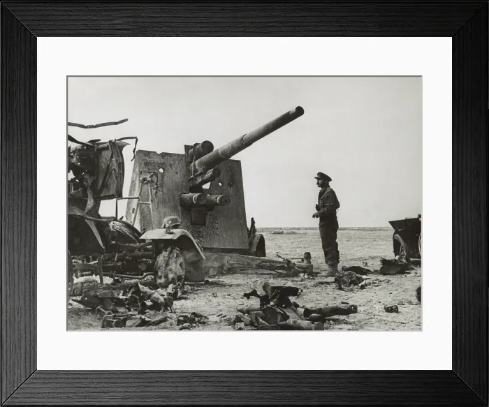 Framed Print : British army officer looks at a destroyed German dual purpose 88 millimeter gun. It was put out of action by British Artillery near El Gubbi. Ca. 1940-42 during World War 2 Framed Print : British army officer looks at a destroyed German dual purpose 88 millimeter gun. It was put out of action by British Artillery near El Gubbi. Ca. 1940-42 during World War 2