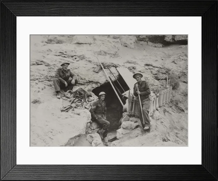 Framed Print : British defenders of the Tobruk garrison find sanctuary from the nightly bombing. They shelter in dug out caves with six to ten feet of solid rock as a roof. April - Nov Framed Print : British defenders of the Tobruk garrison find sanctuary from the nightly bombing. They shelter in dug out caves with six to ten feet of solid rock as a roof. April - Nov