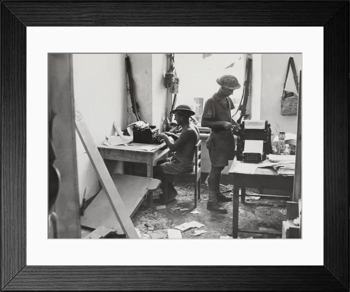 Framed Print : In their bomb damaged office, British soldiers at produce a news sheet. It appears daily under the title of Tobruk Truch'. 1941 during World War 2. (BSLOC_2013-12_51) Framed Print : In their bomb damaged office, British soldiers at produce a news sheet. It appears daily under the title of Tobruk Truch'. 1941 during World War 2. (BSLOC_2013-12_51)