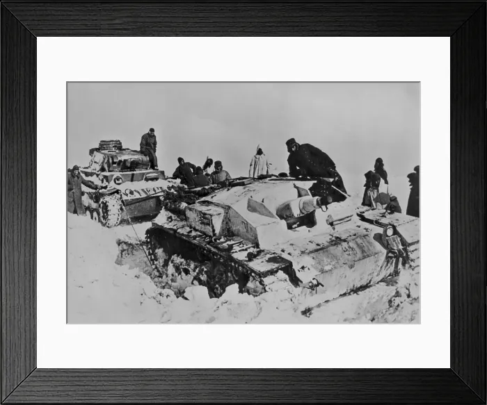 Framed Print : German tank stuck in heavy snow in Russian in April 1942. Soldiers use the tank on left is attempting to free the immobilized vehicle. (BSLOC_2013-12_4)