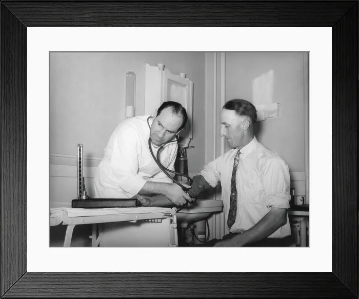 Framed Print : Doctor at a medical cooperative taking blood pressure of a patient in Box Elder County, Utah, 1940