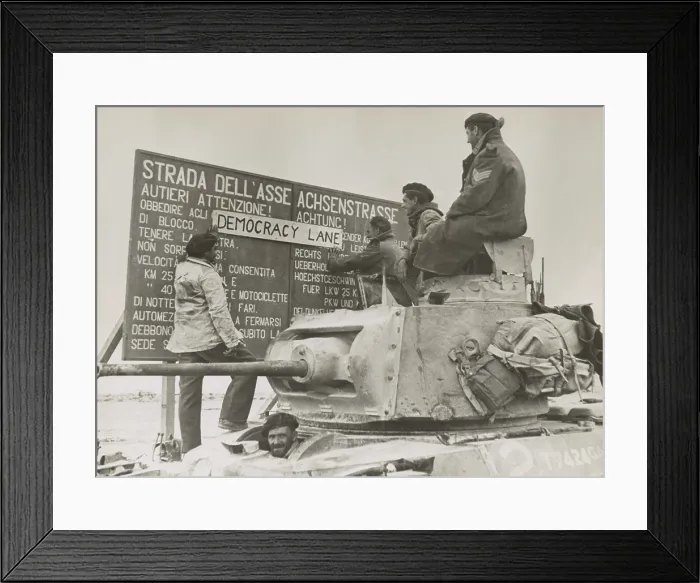 Framed Print : After the British victory at El Alamein, a British tank crew alters an Italian-German language sign