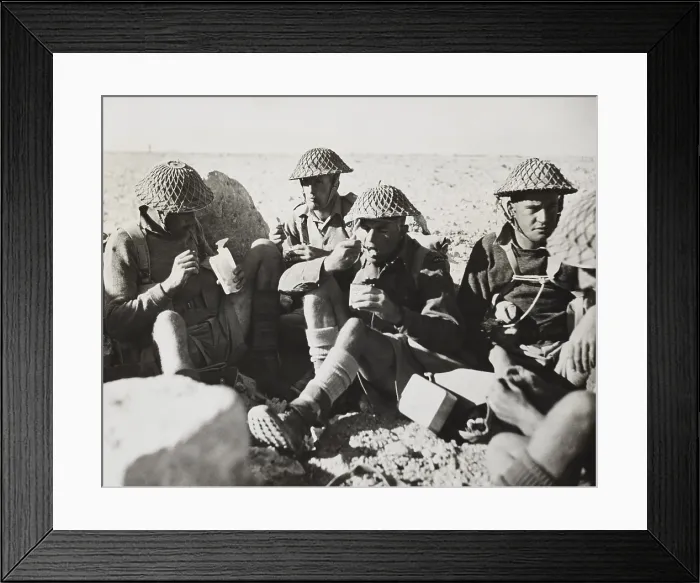 Framed Print : New Zealanders in Libya eat lunch during World War 2. In center, spoon-to-mouth, is 2nd Lt. Charles Kazlett Upham, awarded the Victoria Cross during the fighting in Crete. Ca Framed Print : New Zealanders in Libya eat lunch during World War 2. In center, spoon-to-mouth, is 2nd Lt. Charles Kazlett Upham, awarded the Victoria Cross during the fighting in Crete. Ca