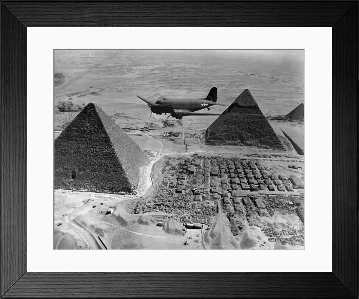 Framed Print : American Air Transport Command plane flies over the pyramids of Egypt. Flights from the U.S. supplied strategic battle zones of North Africa during World War 2. 1943