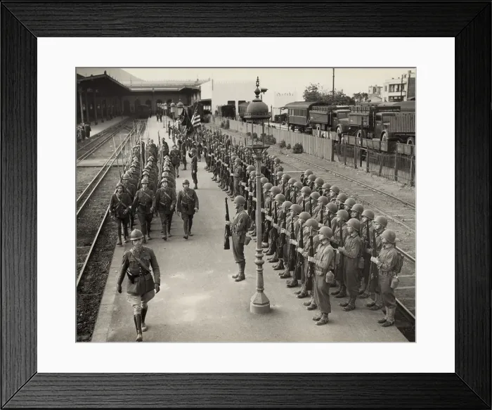 Framed Print : American soldiers present arms as French soldiers march past in Oran, Algeria, Dec. 2, 1942