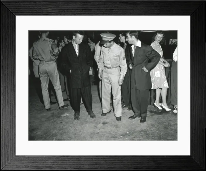 Framed Print : Soldier inspects Zoot Suiters at an intermission of Woody Herman's Orchestra engagement. At the Uline Arena, Washington, D.C. June 1942 Framed Print : Soldier inspects Zoot Suiters at an intermission of Woody Herman's Orchestra engagement. At the Uline Arena, Washington, D.C. June 1942