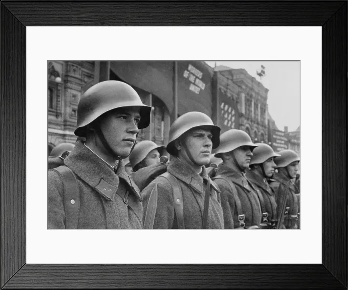 Framed Print : Red Army soldiers in formation in a city square. In the background a banner reads, Workers of the World Unit!'. Ca. 1941. (BSLOC_2013-12_9)