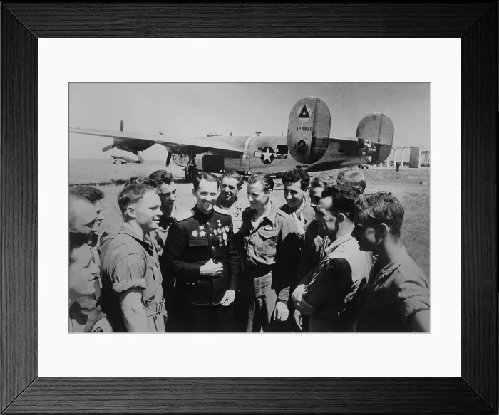 Framed Print : Soviet (Russian) World War 2 ace Mikhail Avdeev with American pilots. In the background is a Consolidated B-24 Liberator bomber, at Sevastopol, Ukraine, 1944 Framed Print : Soviet (Russian) World War 2 ace Mikhail Avdeev with American pilots. In the background is a Consolidated B-24 Liberator bomber, at Sevastopol, Ukraine, 1944