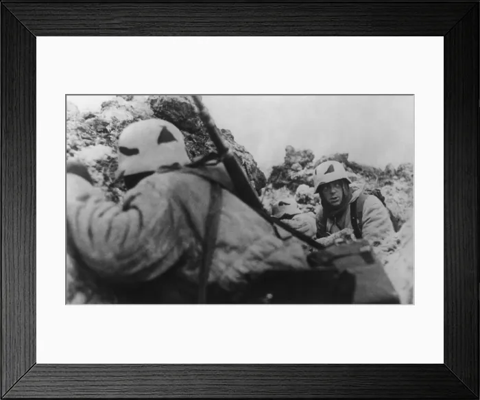 Framed Print : German soldiers crouching behind earthworks near Leningrad during Soviet (Russian) bombardment. Ca. 1943 during World War 2. (BSLOC_2014_8_38)