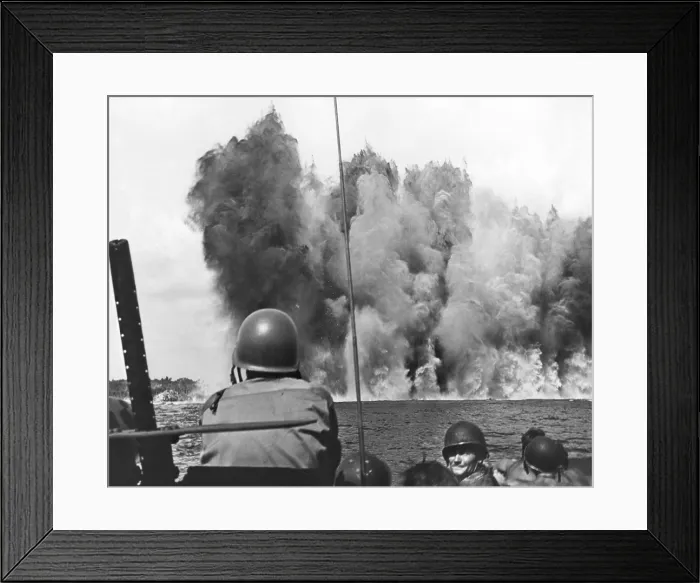 Framed Print : A massive wall rises from the water of Peleliu from an Underwater Demolition Team operation. The explosion of 8, 000 lbs. of tetrytol concluded mine clearing prior to the U.S