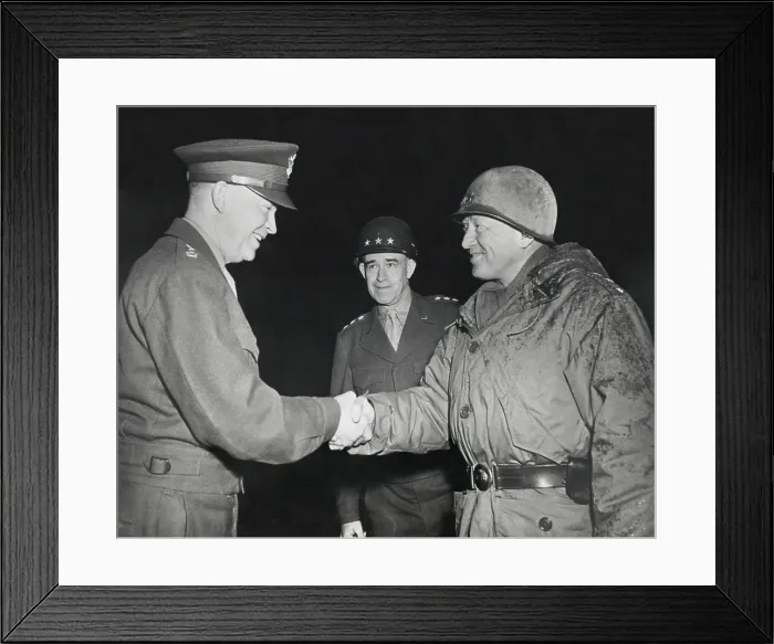 Framed Print : General Dwight Eisenhower shakes hands with Gen. George Patton at the front in 1945. Patton is in battle dress. Gen. Omar Bradley stands in the background. (BSLOC_2013-12_99) Framed Print : General Dwight Eisenhower shakes hands with Gen. George Patton at the front in 1945. Patton is in battle dress. Gen. Omar Bradley stands in the background. (BSLOC_2013-12_99)