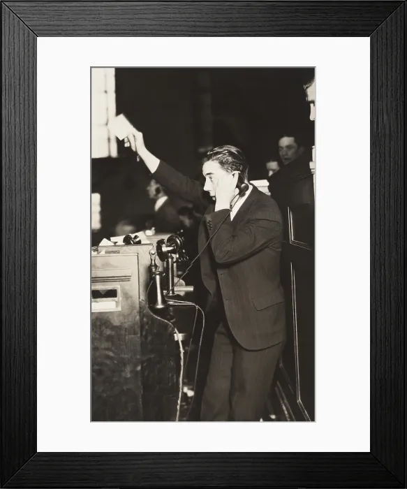 Framed Print : Telephone clerk waving a note and calling a trader on the floor of the New York Curb Exchange. Jan. 24, 1929 (BSLOC_2016_8_31)