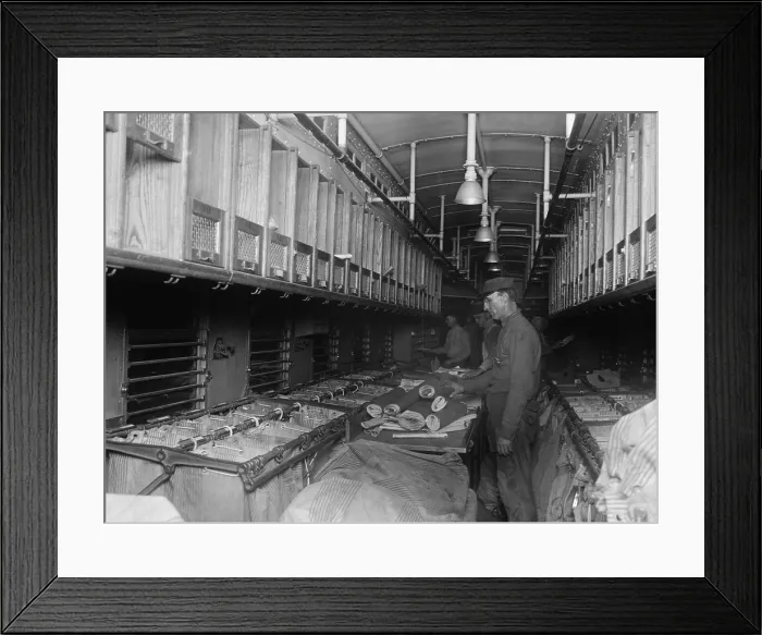 Framed Print : Railway Post Office (RPO) clerks sorting mail aboard a customized rail car in 1924. RPO clerks spent days away from home, traveling through the America (BSLOC_2016_8_26) Framed Print : Railway Post Office (RPO) clerks sorting mail aboard a customized rail car in 1924. RPO clerks spent days away from home, traveling through the America (BSLOC_2016_8_26)