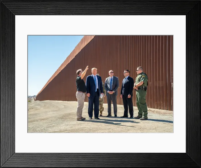 Framed Print : President Donald Trump, visits a walled section of the US-Mexico border at Otay Mesa, a neighborhood along the Mexican border in San Diego, Calif. Wednesday, Sept
