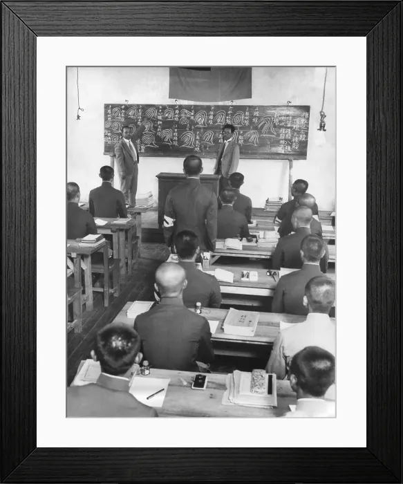 Framed Print : Japanese in Manchukuo create a new 100, 000 police force in 60 days. Japanese instructors from Tokyo drill peasants in reading fingerprints. The instructor has an interpreter