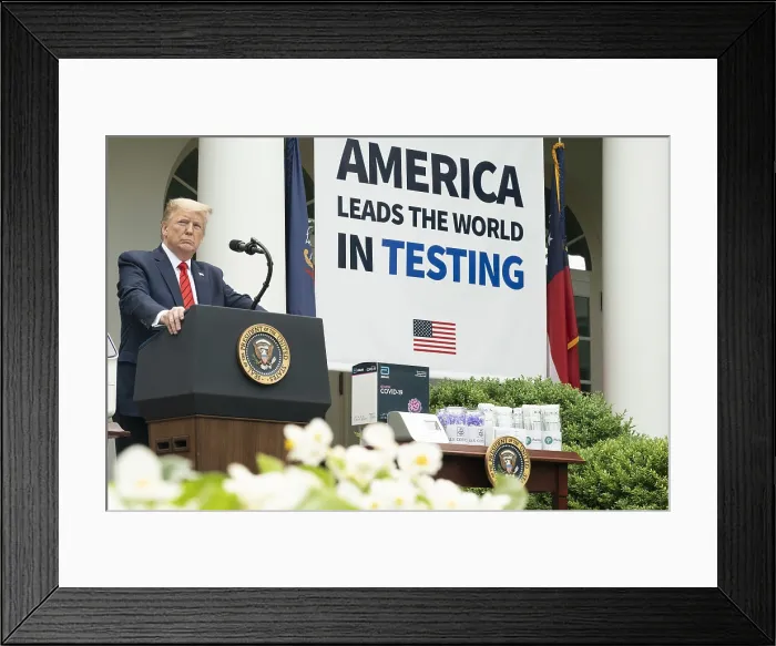 Framed Print : President Donald Trump stands beside a large sign proclaiming, AMERICA LEADS THE WORLD IN TESTING Framed Print : President Donald Trump stands beside a large sign proclaiming, AMERICA LEADS THE WORLD IN TESTING