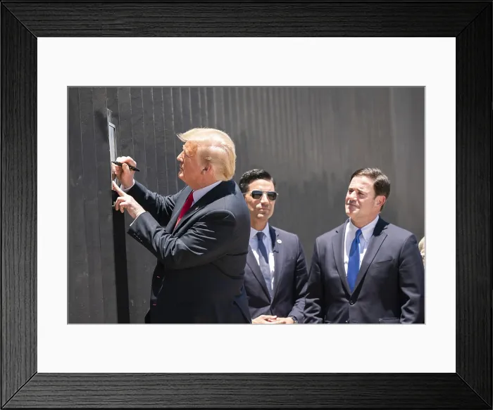Framed Print : President Donald Trump signs a plaque commemorating the 200th mile of new border wall along the US-Mexico border near Yuma. June 23, 2020 (BSLOC_2020_5_15)