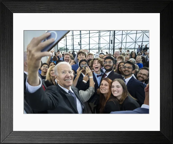 Framed Print : President Joe Biden takes a selfie with guests after delivering his Cancer Moonshot speech on Sept. 12, 2022, at the JFK Presidential Library in Boston. (BSLOC_2022_7_25)