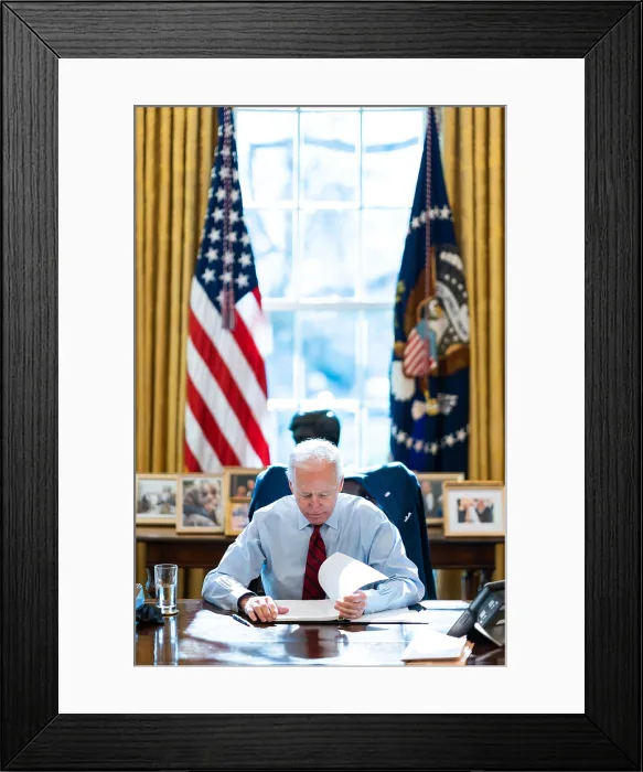 Framed Print : President Joe Biden reading documents at his desk in the White House Oval Office, Jan. 28, 2021 (BSLOC_2021_4_12)