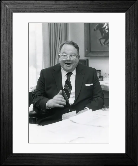 Framed Print : Nelson Bunker Hunt, son of oil tycoon H. L. Hunt, ca. 1980 in his office decorated with paintings of thoroughbred race horses. His horse, Empery, won the British Derby in 1976