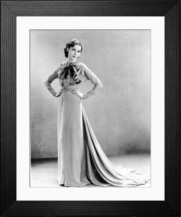 Framed Print : THE GREAT IMPERSONATION, Valerie Hobson, in a rose-colored tea gown with satin bands, by Vera West, 1935